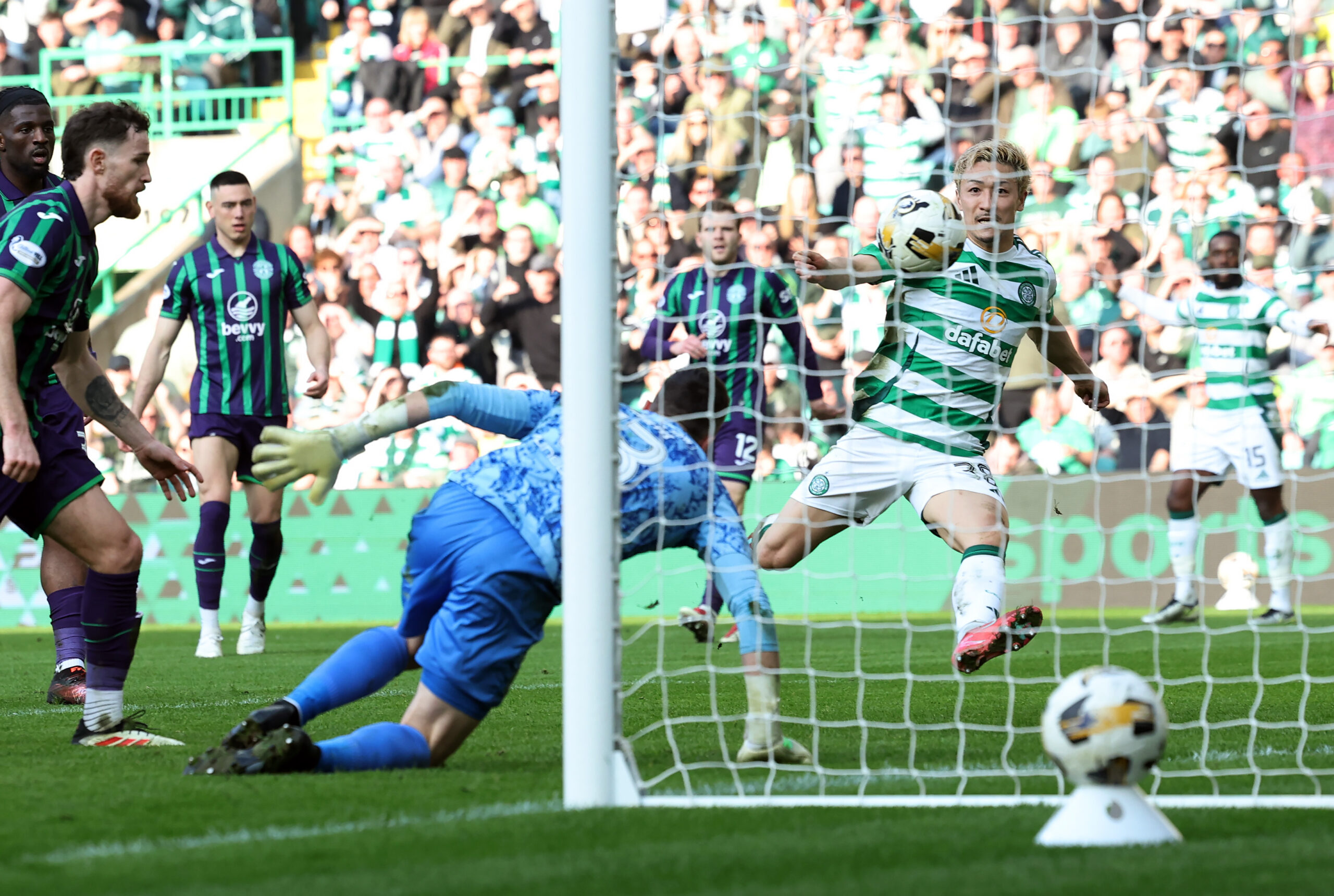 Celtic forward Maeda scores a goal against Hibernian