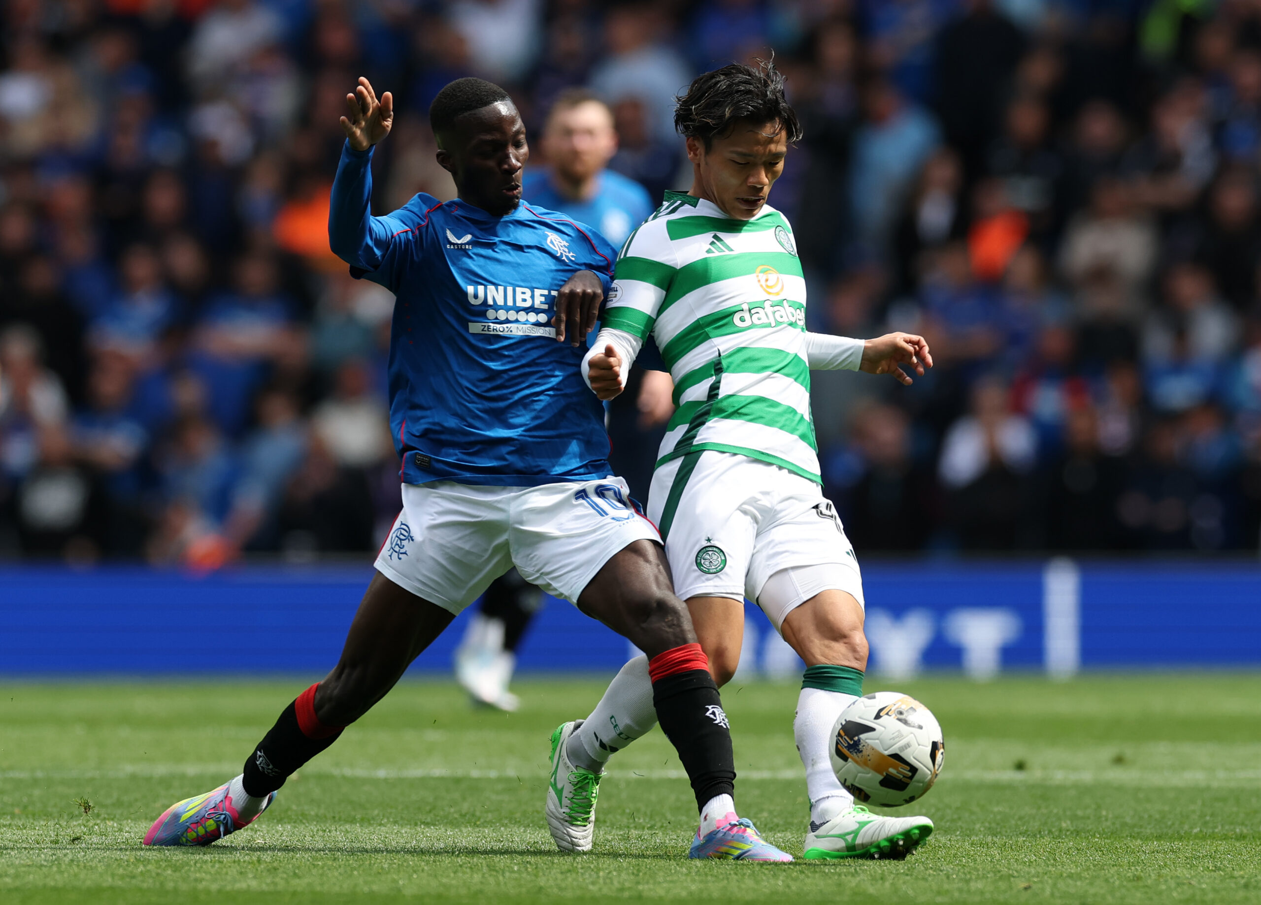 Rangers midfield ace Diomande in action against Celtic's Hatate