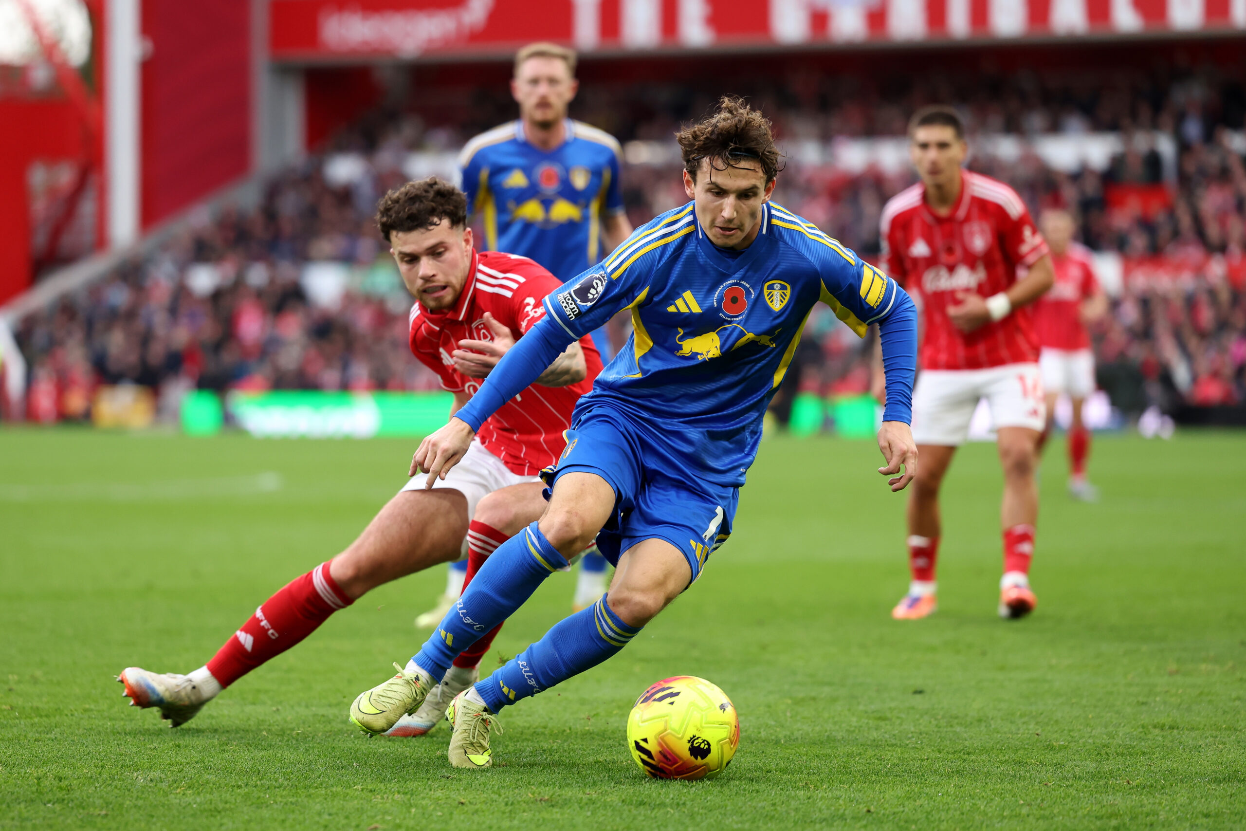 Leeds attacker Aaronson in action against Forest