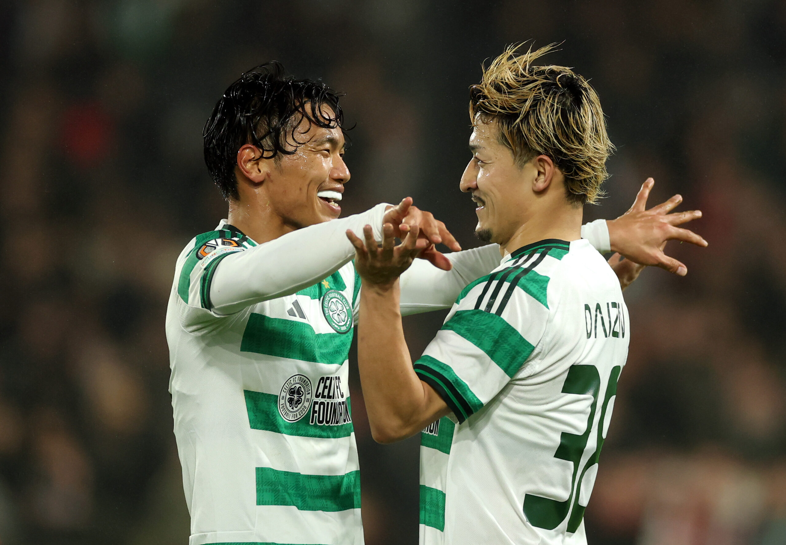 Japanese duo of Maeda and Hatate celebrate a Celtic goal
