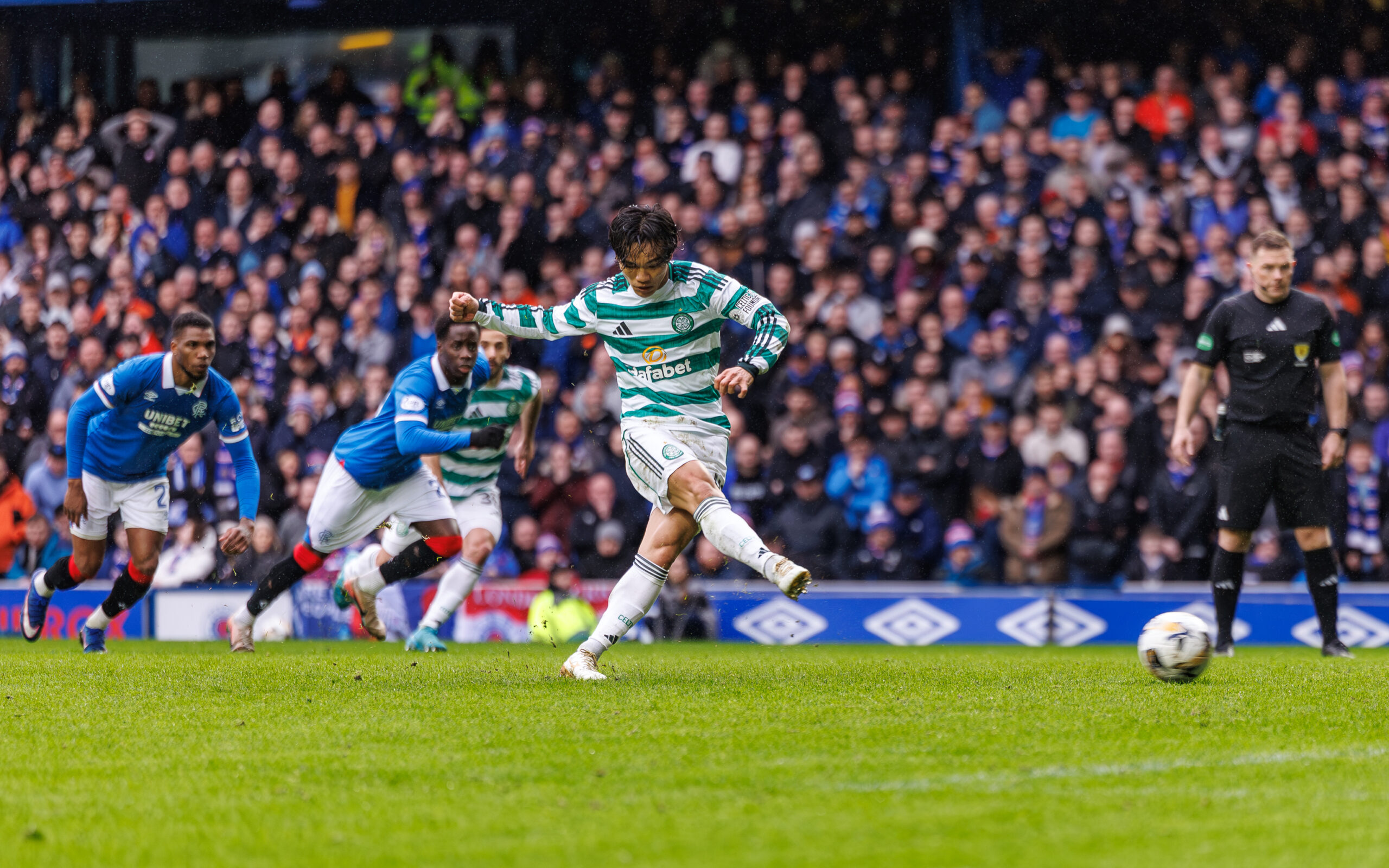 Celtic midfielder Hatate takes a spot-kick against Rangers