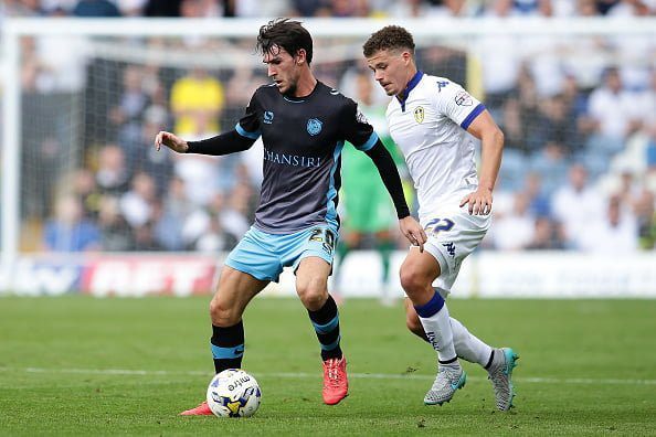LEEDS, ENGLAND - AUGUST 22: Kieran Lee of Sheffield Wednesday FC maintains control over Kalvin Phillips of Leeds United FC during the Sky Bet Championship match between Leeds United and Sheffield Wednesday at Elland Road on August 22, 2015 in Leeds, England.  (Photo by Daniel Smith/Getty Images)