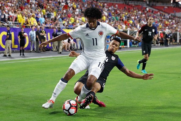 GLENDALE, AZ - JUNE 25:  Juan Cuadrado #11 of Colombia is tackled by Michael Orozco #14 of United States during the first half of the 2016 Copa America Centenario third place match at University of Phoenix Stadium on June 25, 2016 in Glendale, Arizona.  (Photo by Christian Petersen/Getty Images)