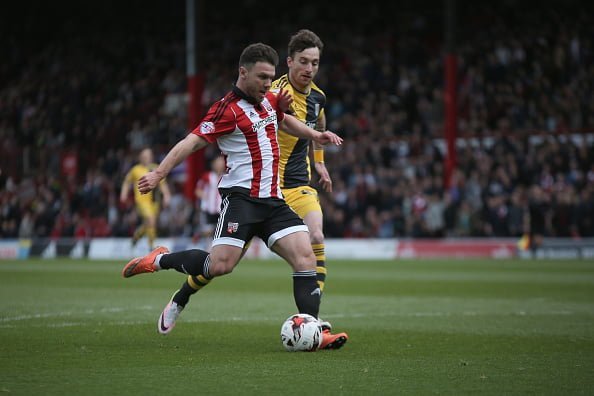 BRENTFORD, ENGLAND - APRIL 30: Scott Hogan of Brentford scores their second during the Sky Bet Championship match between Brentford and Fulham at Griffin Park on April 30, 2016 in Brentford, United Kingdom. (Photo by Harry Murphy/Getty Images)