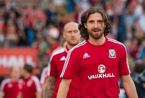 CARDIFF, WALES - JULY 08: Wales' Joe Allen walks onto the pitch during a ceremony at the Cardiff City Stadium on July 8, 2016 in Cardiff, Wales. The players toured the streets of Cardiff in an open top bus before arriving at the Cardiff City Stadium for an after party for which 33,000 tickets have been sold. Wales historic run in Euro 2016 saw them reach the semi-finals, before being knocked out 2-0 by Portugal at Stade de Lyon in France. (Photo by Matthew Horwood/Getty Images)