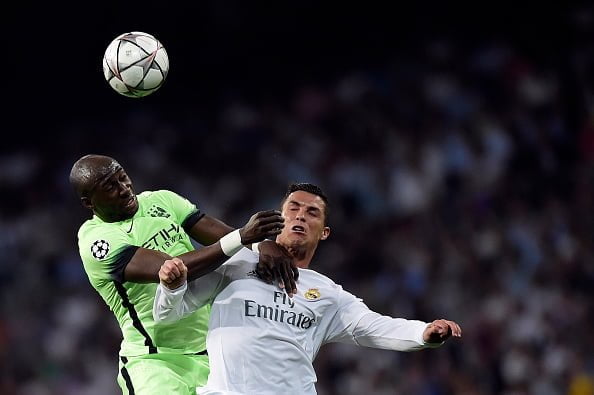TOPSHOT - Manchester City's French defender Eliaquim Mangala (L) vies with Real Madrid's Portuguese forward Cristiano Ronaldo during the UEFA Champions League semi-final second leg football match Real Madrid CF vs Manchester City FC at the Santiago Bernabeu stadium in Madrid, on May 4, 2016. / AFP / JAVIER SORIANO        (Photo credit should read JAVIER SORIANO/AFP/Getty Images)