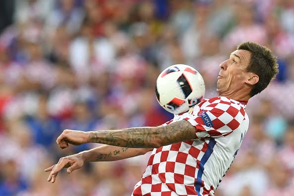 Croatia's forward Mario Mandzukic jumps for the ball during the round of sixteen football match Croatia against Portugal of the Euro 2016 football tournament, on June 25, 2016 at the Bollaert-Delelis stadium in Lens. / AFP / FRANCISCO LEONG        (Photo credit should read FRANCISCO LEONG/AFP/Getty Images)