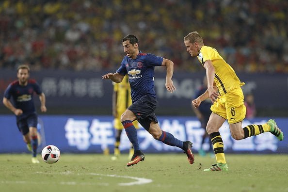 SHANGHAI, CHINA - JULY 22:  Henrikh Mkhitaryan (L) of Manchester United competes for the ball with Sven Bender of Borussia Dortmund during the International Champions Cup match between Manchester United and Borussia Dortmund at Shanghai Stadium on July 22, 2016 in Shanghai, China.  (Photo by Lintao Zhang/Getty Images)