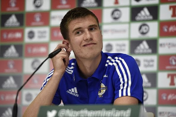 Northern Ireland's defender Paddy McNair is pictured during a press conference at the team's training ground in Saint George de Reneins on June 10, 2016, ahead of the Euro 2016 football tournament. / AFP / PHILIPPE DESMAZES        (Photo credit should read PHILIPPE DESMAZES/AFP/Getty Images)