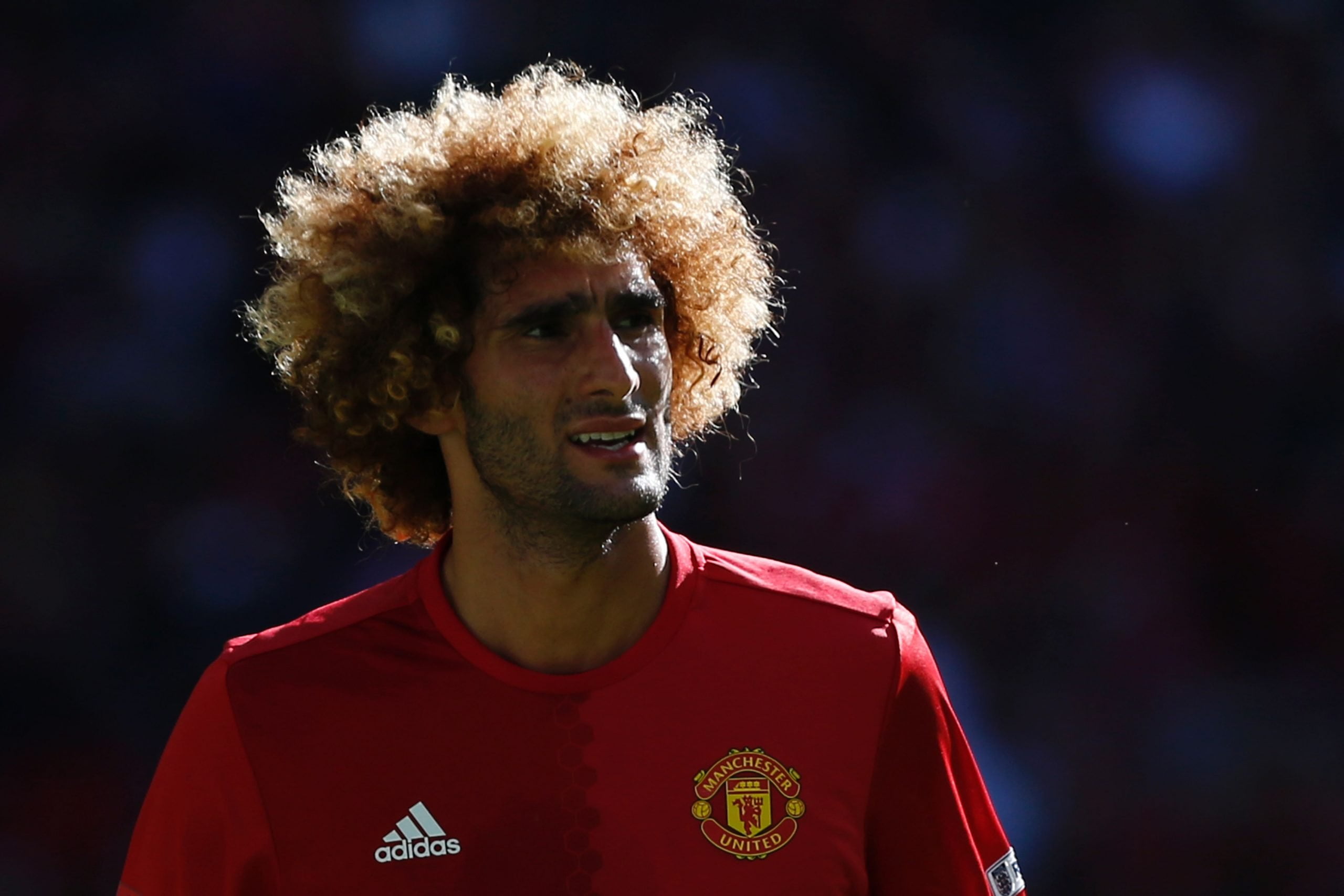 Manchester United's Belgian midfielder Marouane Fellaini reacts during the FA Community Shield football match between Manchester United and Leicester City at Wembley Stadium in London on August 7, 2016.  / AFP / Ian Kington / NOT FOR MARKETING OR ADVERTISING USE / RESTRICTED TO EDITORIAL USE        (Photo credit should read IAN KINGTON/AFP/Getty Images)