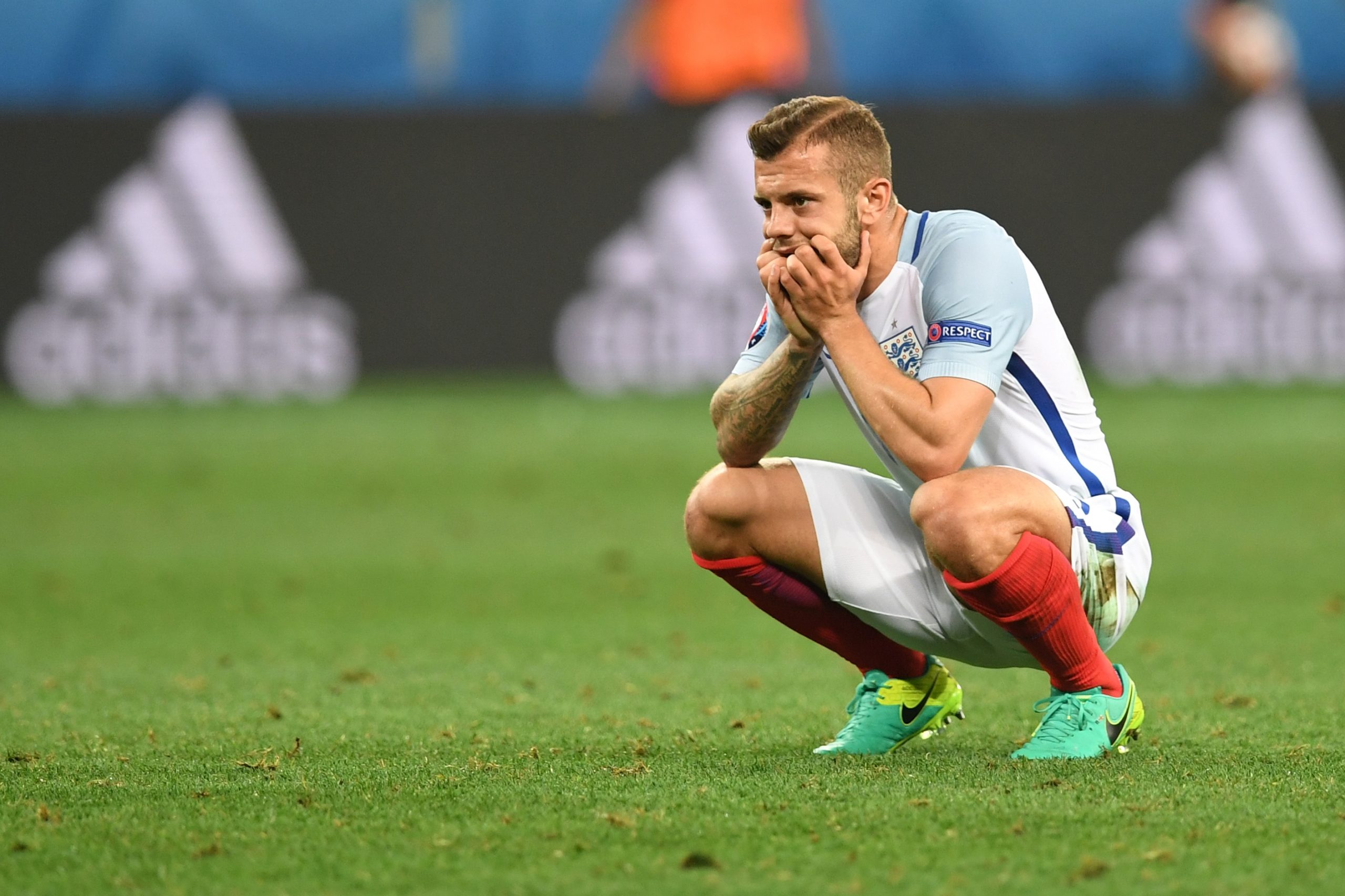 England's midfielder Jack Wilshere reacts after England lost 1-2 to Iceland in the Euro 2016 round of 16 football match between England and Iceland at the Allianz Riviera stadium in Nice on June 27, 2016.   / AFP / PAUL ELLIS        (Photo credit should read PAUL ELLIS/AFP/Getty Images)