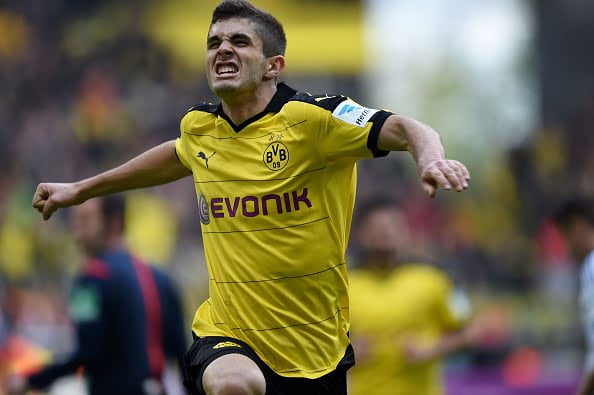 Dortmund's midfielder Christian Pulisic celebrates scoring the 1-0 goal during the German Bundesliga first division football match BVB Borussia Dortmund vs Hamburg SV in Dortmund, western Germany, on April 17, 2016.
 / AFP / PATRIK STOLLARZ / RESTRICTIONS: DURING MATCH TIME: DFL RULES TO LIMIT THE ONLINE USAGE TO 15 PICTURES PER MATCH AND FORBID IMAGE SEQUENCES TO SIMULATE VIDEO. == RESTRICTED TO EDITORIAL USE == FOR FURTHER QUERIES PLEASE CONTACT DFL DIRECTLY AT + 49 69 650050
        (Photo credit should read PATRIK STOLLARZ/AFP/Getty Images)