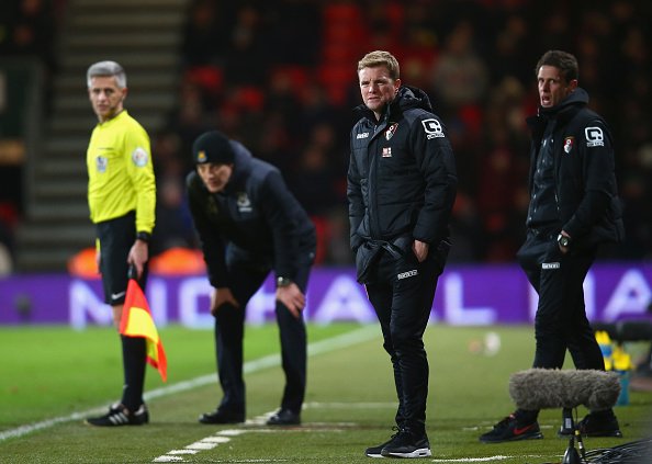 BOURNEMOUTH, ENGLAND - JANUARY 12:  Slaven Bilic manager of West Ham United (2L) and Eddie Howe manager of Bournemouth (2R) look on from the touchline during the Barclays Premier League match between A.F.C. Bournemouth and West Ham United at Vitality Stadium on January 12, 2016 in Bournemouth, England.  (Photo by Clive Rose/Getty Images)