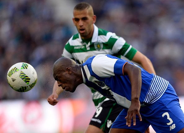 Porto's Dutch defender Bruno Martins Indi (L) heads the ball next to Sporting's Algerian forward Islam Slimani during the Portuguese league football match FC Porto vs Sporting CP at the Dragao stadium in Porto on April 30, 2016. / AFP / MIGUEL RIOPA        (Photo credit should read MIGUEL RIOPA/AFP/Getty Images)