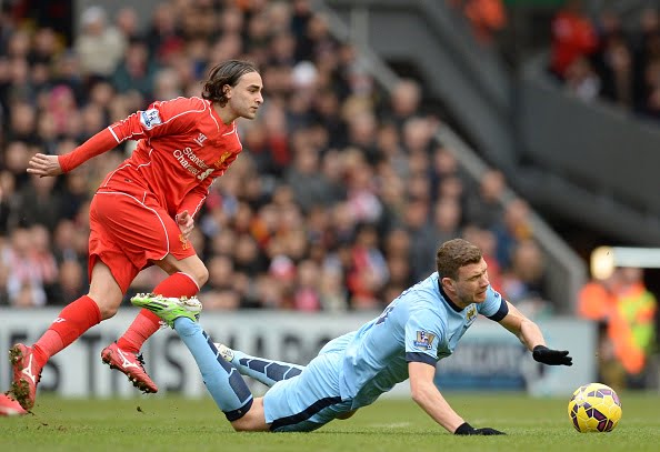 Manchester City's Bosnian striker Edin Dzeko (R) vies with Liverpool's Serbian midfielder Lazar Markovic during the English Premier League football match between Liverpool and Manchester City at the Anfield stadium in Liverpool, north west England, on March 1, 2015. AFP PHOTO / OLI SCARFF
RESTRICTED TO EDITORIAL USE. NO USE WITH UNAUTHORIZED AUDIO, VIDEO, DATA, FIXTURE LISTS, CLUB/LEAGUE LOGOS OR "LIVE" SERVICES. ONLINE IN-MATCH USE LIMITED TO 45 IMAGES, NO VIDEO EMULATION. NO USE IN BETTING, GAMES OR SINGLE CLUB/LEAGUE/PLAYER PUBLICATIONS.        (Photo credit should read OLI SCARFF/AFP/Getty Images)