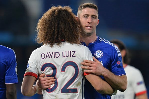 Chelsea's English defender Gary Cahill (R) embraces Paris Saint-Germain's Brazilian defender David Luiz (L) at the end of the UEFA Champions League round of 16 second leg football match between Chelsea and Paris Saint-Germain (PSG) at Stamford Bridge in London on March 9, 2016.  / AFP / GLYN KIRK        (Photo credit should read GLYN KIRK/AFP/Getty Images)