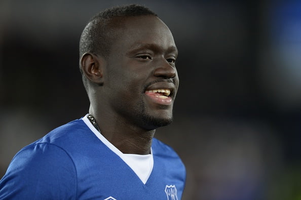 Everton's Senegalese striker Oumar Niasse greets the crowd on the pitch before the English Premier League football match between Everton and Newcastle United at Goodison Park in Liverpool, north west England on February 3, 2016. / AFP / OLI SCARFF / RESTRICTED TO EDITORIAL USE. No use with unauthorized audio, video, data, fixture lists, club/league logos or 'live' services. Online in-match use limited to 75 images, no video emulation. No use in betting, games or single club/league/player publications.  /         (Photo credit should read OLI SCARFF/AFP/Getty Images)