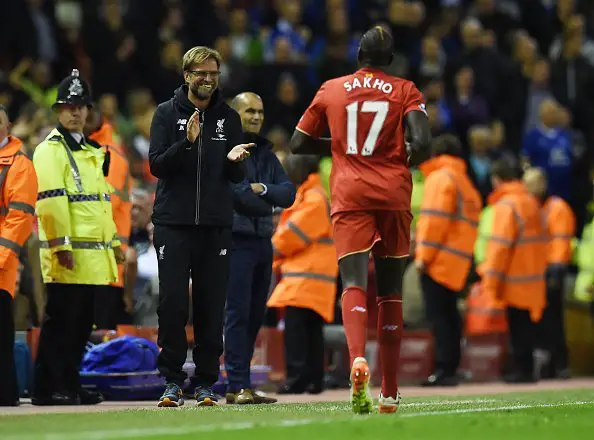 Liverpool's French defender Mamadou Sakho (R) celebrates with Liverpool's German manager Jurgen Klopp after scoring during the English Premier League football match between Liverpool and Everton at Anfield in Liverpool, north west England on April 20, 2016. / AFP / PAUL ELLIS / RESTRICTED TO EDITORIAL USE. No use with unauthorized audio, video, data, fixture lists, club/league logos or 'live' services. Online in-match use limited to 75 images, no video emulation. No use in betting, games or single club/league/player publications.  /         (Photo credit should read PAUL ELLIS/AFP/Getty Images)