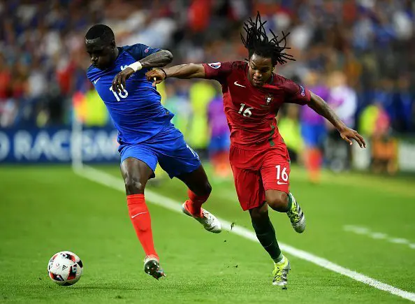 PARIS, FRANCE - JULY 10:  Moussa Sissoko of France and Renato Sanches of Portugal compete for the ball during the UEFA EURO 2016 Final match between Portugal and France at Stade de France on July 10, 2016 in Paris, France.  (Photo by Matthias Hangst/Getty Images)