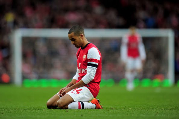 LONDON, ENGLAND - FEBRUARY 16:  A dejected Theo Walcott of Arsenal looks on during the FA Cup with Budweiser fifth round match between Arsenal and Blackburn Rovers at Emirates Stadium on February 16, 2013 in London, England.  (Photo by Shaun Botterill/Getty Images)