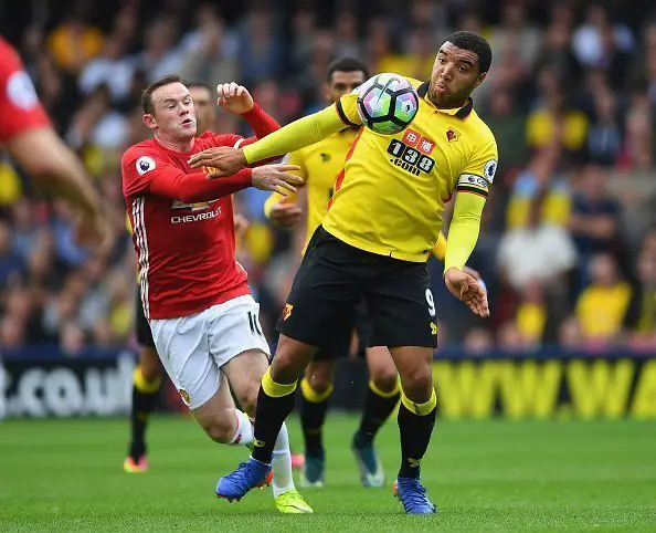 WATFORD, ENGLAND - SEPTEMBER 18: Troy Deeney of Watford battles with Wayne Rooney of Manchester United during the Premier League match between Watford and Manchester United at Vicarage Road on September 18, 2016 in Watford, England.  (Photo by Laurence Griffiths/Getty Images)