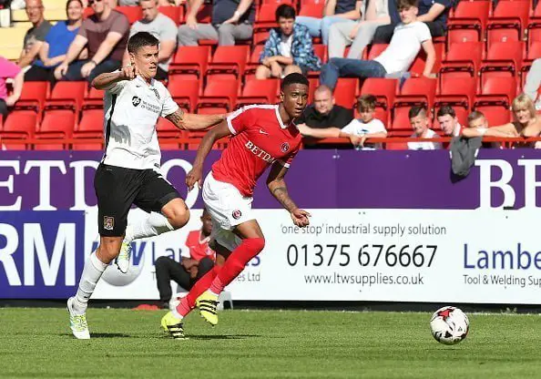LONDON, ENGLAND - AUGUST 13:  Ezri Konsa of Charlton Athletic looks to the ball with Alex Revell of Northampton Town during the Sky Bet League One match between Charlton Athletic and Northampton Town at The Valley on August 13, 2016 in London, England.  (Photo by Pete Norton/Getty Images)