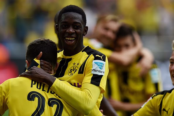 Dortmund's French midfielder Ousmane Dembele (C) celebrates during the German first division Bundesliga football match of Borussia Dortmund vs SV Darmstadt 98 in Dortmund, western Germany, on September 17, 2016. / AFP / PATRIK STOLLARZ / RESTRICTIONS: DURING MATCH TIME: DFL RULES TO LIMIT THE ONLINE USAGE TO 15 PICTURES PER MATCH AND FORBID IMAGE SEQUENCES TO SIMULATE VIDEO. == RESTRICTED TO EDITORIAL USE == FOR FURTHER QUERIES PLEASE CONTACT DFL DIRECTLY AT + 49 69 650050
        (Photo credit should read PATRIK STOLLARZ/AFP/Getty Images)