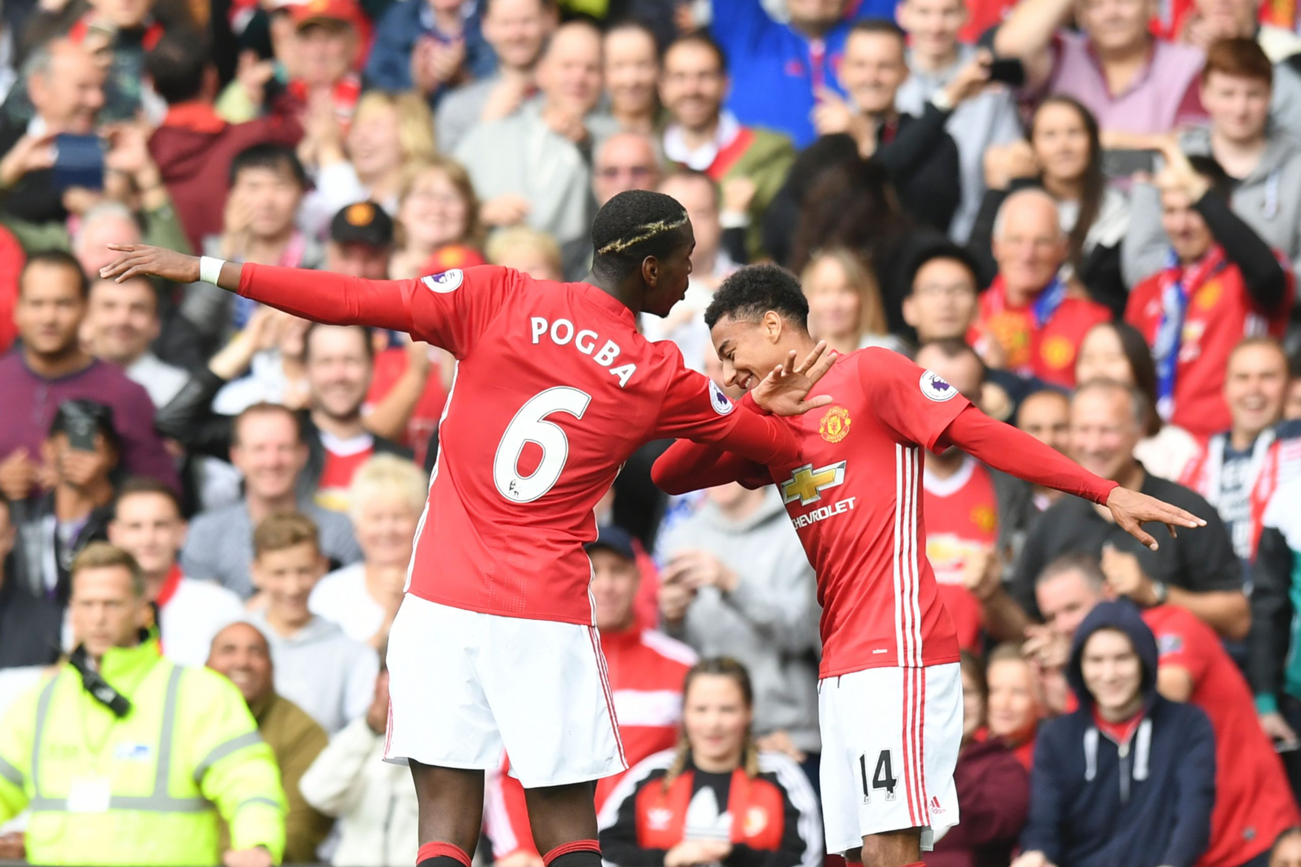 Manchester United's French midfielder Paul Pogba (L) and Manchester United's English midfielder Jesse Lingard (R) celebrate after Pogba scored their fourth goal during the English Premier League football match between Manchester United and Leicester City at Old Trafford in Manchester, north west England, on September 24, 2016. / AFP / ANTHONY DEVLIN / RESTRICTED TO EDITORIAL USE. No use with unauthorized audio, video, data, fixture lists, club/league logos or 'live' services. Online in-match use limited to 75 images, no video emulation. No use in betting, games or single club/league/player publications.  /         (Photo credit should read ANTHONY DEVLIN/AFP/Getty Images)