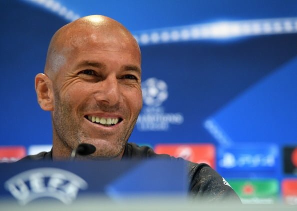 Real Madrid's French coach Zinedine Zidane smiles during a press conference at Valdebebas Sport City in Madrid on September 13, 2016 on the eve of the UEFA Champions League group stage football match Real Madrid CF vs Sporting Clube Portugal. / AFP / GERARD JULIEN        (Photo credit should read GERARD JULIEN/AFP/Getty Images)