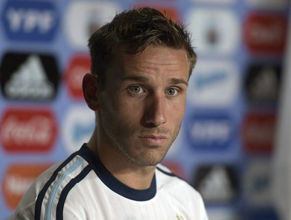 Argentina's midfielder Lucas Biglia, during a press conference in Ezeiza, Buenos Aires on August 30, 2016 ahead of atheir 2018 FIFA World Cup Russia South American qualifier football match against Uruguay to be held in Mendoza on September 1. / AFP / JUAN MABROMATA        (Photo credit should read JUAN MABROMATA/AFP/Getty Images)