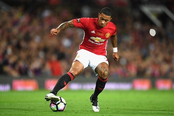 MANCHESTER, ENGLAND - AUGUST 03:  Memphis Depay of Manchester United in action during the Wayne Rooney Testimonial match between Manchester United and Everton at Old Trafford on August 3, 2016 in Manchester, England.  (Photo by Michael Regan/Getty Images)