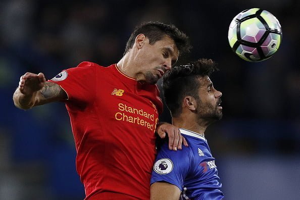 Liverpool's Croatian defender Dejan Lovren (L) and Chelsea's Brazilian-born Spanish striker Diego Costa vie for the ball during the English Premier League football match between Chelsea and Liverpool at Stamford Bridge in London on September 16, 2016. / AFP / Adrian DENNIS / RESTRICTED TO EDITORIAL USE. No use with unauthorized audio, video, data, fixture lists, club/league logos or 'live' services. Online in-match use limited to 75 images, no video emulation. No use in betting, games or single club/league/player publications.  /         (Photo credit should read ADRIAN DENNIS/AFP/Getty Images)