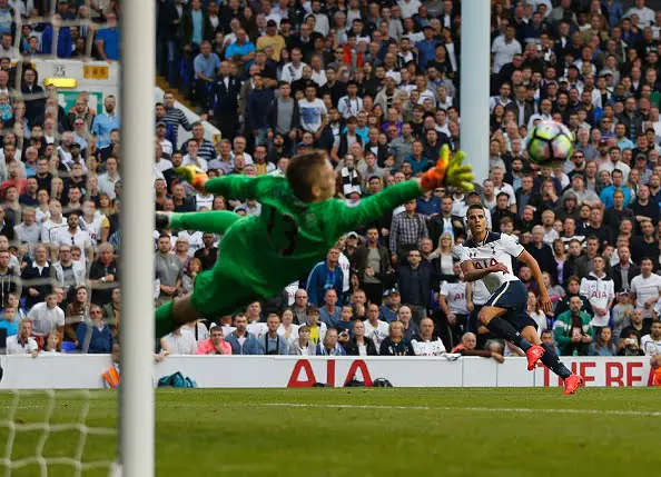 Tottenham Hotspur's Argentinian midfielder Erik Lamela (R) sees his shot saved by Sunderland's English goalkeeper Jordan Pickford during the English Premier League football match between Tottenham Hotspur and Sunderland at White Hart Lane in London, on September 18, 2016. / AFP / Ian KINGTON / RESTRICTED TO EDITORIAL USE. No use with unauthorized audio, video, data, fixture lists, club/league logos or 'live' services. Online in-match use limited to 75 images, no video emulation. No use in betting, games or single club/league/player publications.  /         (Photo credit should read IAN KINGTON/AFP/Getty Images)