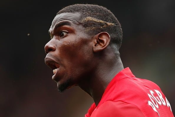 Manchester United's French midfielder Paul Pogba shouts at the linesman during the English Premier League football match between Watford and Manchester United at Vicarage Road Stadium in Watford, north of London on September 18, 2016. / AFP / Adrian DENNIS / RESTRICTED TO EDITORIAL USE. No use with unauthorized audio, video, data, fixture lists, club/league logos or 'live' services. Online in-match use limited to 75 images, no video emulation. No use in betting, games or single club/league/player publications.  /         (Photo credit should read ADRIAN DENNIS/AFP/Getty Images)