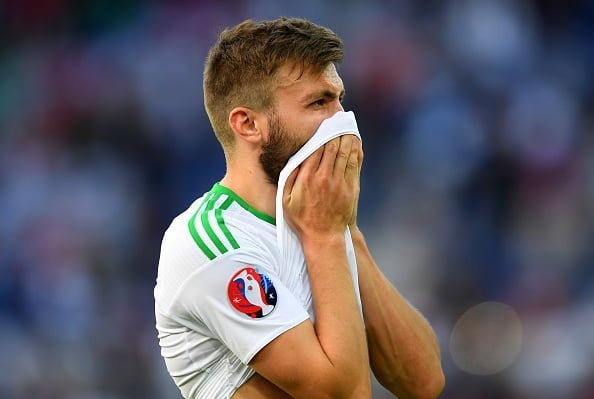 PARIS, FRANCE - JUNE 25:  Stuart Dallas of Northern Ireland shows his dejection after his team's 0-1 defeat in the UEFA EURO 2016 round of 16 match between Wales and Northern Ireland at Parc des Princes on June 25, 2016 in Paris, France.  (Photo by Matthias Hangst/Getty Images)