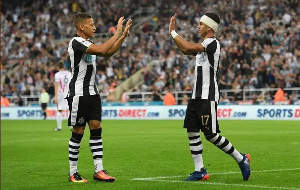 NEWCASTLE UPON TYNE, ENGLAND - AUGUST 23:  Ayoze Perez (R) of Newcastle United celebrates scoring his team's second goal with Dwight Gayle during the EFL Cup second round match between Newcastle United and Cheltenham Town at St. James' Park on August 23, 2016 in Newcastle upon Tyne, England.  (Photo by Stu Forster/Getty Images)