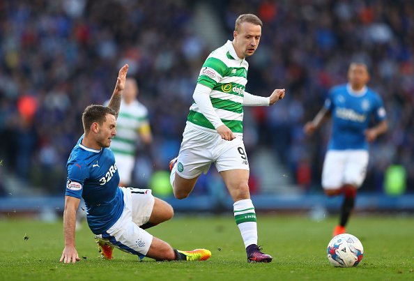 GLASGOW, SCOTLAND - OCTOBER 23:  Leigh Griffiths of Celtic rides a tackle from Rob Kiernan of Rangers during the Betfred Cup Semi Final match between Rangers and Celtic at Hampden Park on October 23, 2016 in Glasgow, Scotland.  (Photo by Michael Steele/Getty Images)