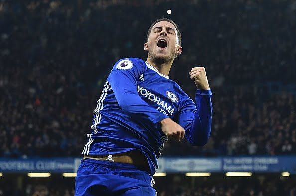 Chelsea's Belgian midfielder Eden Hazard celebrates after scoring their third goal during the English Premier League football match between Chelsea and Manchester United at Stamford Bridge in London on October 23, 2016. / AFP / Glyn KIRK / RESTRICTED TO EDITORIAL USE. No use with unauthorized audio, video, data, fixture lists, club/league logos or 'live' services. Online in-match use limited to 75 images, no video emulation. No use in betting, games or single club/league/player publications.  /         (Photo credit should read GLYN KIRK/AFP/Getty Images)