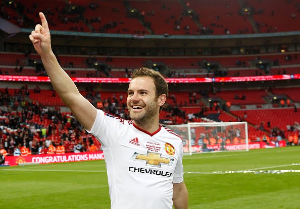Manchester United's Spanish midfielder Juan Mata celebrates after his team won during the English FA Cup final football match between Crystal Palace and Manchester United at Wembley stadium in London on May 21, 2016. / AFP / Ian Kington / NOT FOR MARKETING OR ADVERTISING USE / RESTRICTED TO EDITORIAL USE        (Photo credit should read IAN KINGTON/AFP/Getty Images)