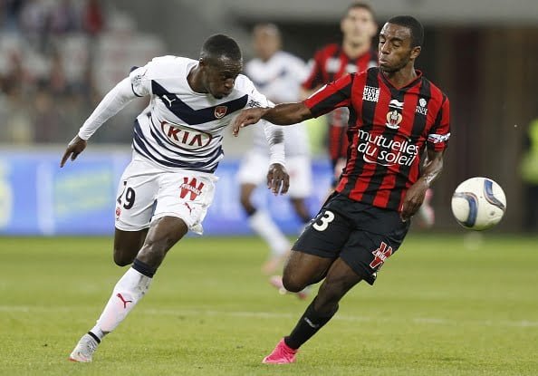Bordeaux's French defender Maxime Poundje (L) vies with Ricardo Pereira (L) during the French L1 football match Nice (OGC Nice) vs Bordeaux (GB) on September 23, 2015 at the "Allianz Riviera" stadium in Nice, southeastern France.  AFP PHOTO / VALERY HACHE        (Photo credit should read VALERY HACHE/AFP/Getty Images)
