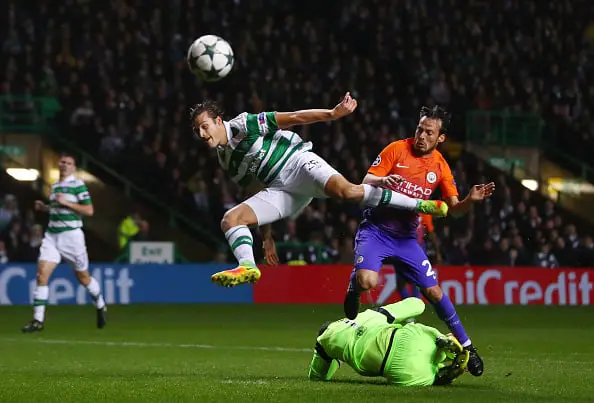 GLASGOW, SCOTLAND - SEPTEMBER 28:  Nir Bitton of Celtic jumps for the ball with David Silva of Manchester City as Craig Gordon of Celtic slides in during the UEFA Champions League group C match between Celtic FC and Manchester City FC at Celtic Park on September 28, 2016 in Glasgow, Scotland.  (Photo by Michael Steele/Getty Images)