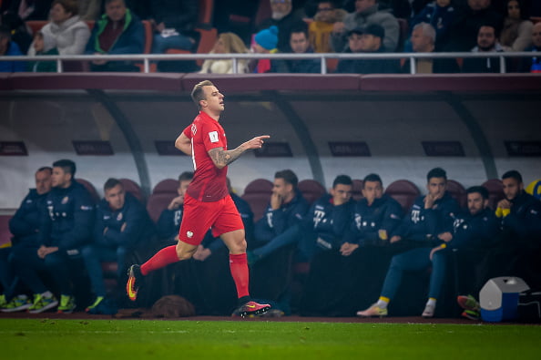 Kamil Grosicki of Poland celebrates after scoring during the World Cup 2018 qualification football match between Romania and Poland in Bucharest, Romania on November 11, 2016.  / AFP / ANDREI PUNGOVSCHI        (Photo credit should read ANDREI PUNGOVSCHI/AFP/Getty Images)