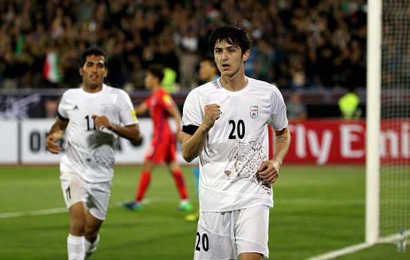 Iran's Sardar Azmoun celebrates after scoring their opening goal during the 2018 World Cup qualifying football match between Iran and South Korea at the Azadi Stadium in Tehran on October 11, 2016. / AFP / ATTA KENARE        (Photo credit should read ATTA KENARE/AFP/Getty Images)
