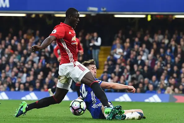 Manchester United's Ivorian defender Eric Bailly vies with Chelsea's English defender Gary Cahill (R) during the English Premier League football match between Chelsea and Manchester United at Stamford Bridge in London on October 23, 2016. / AFP / GLYN KIRK / RESTRICTED TO EDITORIAL USE. No use with unauthorized audio, video, data, fixture lists, club/league logos or 'live' services. Online in-match use limited to 75 images, no video emulation. No use in betting, games or single club/league/player publications.  /         (Photo credit should read GLYN KIRK/AFP/Getty Images)