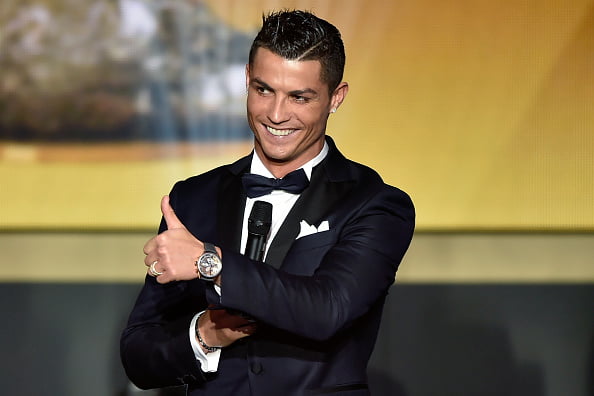 Real Madrid and Portugal's forward Cristiano Ronaldo gestures on stage during the 2015 FIFA Ballon d'Or award ceremony at the Kongresshaus in Zurich on January 11, 2016. AFP PHOTO / FABRICE COFFRINI / AFP / FABRICE COFFRINI        (Photo credit should read FABRICE COFFRINI/AFP/Getty Images)
