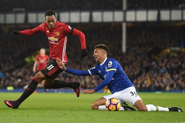 Manchester United's French striker Anthony Martial (L) vies with Everton's English defender Mason Holgate during the English Premier League football match between Everton and Manchester United at Goodison Park in Liverpool, north west England on December 4, 2016.
The game ended 1-1. / AFP / Paul ELLIS / RESTRICTED TO EDITORIAL USE. No use with unauthorized audio, video, data, fixture lists, club/league logos or 'live' services. Online in-match use limited to 75 images, no video emulation. No use in betting, games or single club/league/player publications.  /         (Photo credit should read PAUL ELLIS/AFP/Getty Images)