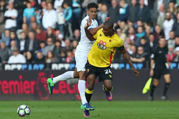 Watford's Nigerian striker Odion Ighalo (R) vies with Swansea City's English defender Kyle Naughton during the English Premier League football match between Swansea City and Watford at The Liberty Stadium in Swansea, south Wales on October 22, 2016. / AFP / Geoff CADDICK / RESTRICTED TO EDITORIAL USE. No use with unauthorized audio, video, data, fixture lists, club/league logos or 'live' services. Online in-match use limited to 75 images, no video emulation. No use in betting, games or single club/league/player publications.  /         (Photo credit should read GEOFF CADDICK/AFP/Getty Images)