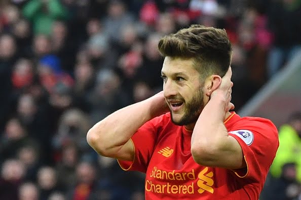 Liverpool's English midfielder Adam Lallana reacts after a missed chance during the English Premier League football match between Liverpool and Swansea City at Anfield in Liverpool, north west England on January 21, 2017. / AFP / Anthony DEVLIN / RESTRICTED TO EDITORIAL USE. No use with unauthorized audio, video, data, fixture lists, club/league logos or 'live' services. Online in-match use limited to 75 images, no video emulation. No use in betting, games or single club/league/player publications.  /         (Photo credit should read ANTHONY DEVLIN/AFP/Getty Images)