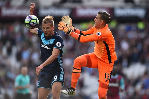 West Ham United's Spanish goalkeeper Adrian (R) goes for a high ball against Middlesbrough's English-born Scottiish striker Jordan Rhodes (L) but fails to gather during the English Premier League football match between West Ham United and Middlesbrough at The London Stadium, in east London on October 1, 2016. / AFP / GLYN KIRK / RESTRICTED TO EDITORIAL USE. No use with unauthorized audio, video, data, fixture lists, club/league logos or 'live' services. Online in-match use limited to 75 images, no video emulation. No use in betting, games or single club/league/player publications.  /         (Photo credit should read GLYN KIRK/AFP/Getty Images)