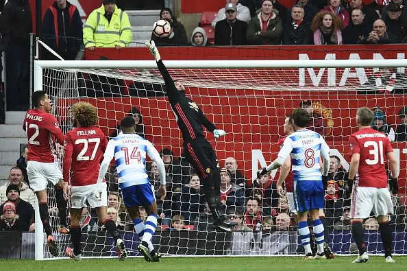 Manchester United's Argentinian goalkeeper Sergio Romero (C) reaches for the ball during the English FA Cup third round football match between Manchester United and Reading at Old Trafford in Manchester, north west England, on January 7, 2017. / AFP / Oli SCARFF / RESTRICTED TO EDITORIAL USE. No use with unauthorized audio, video, data, fixture lists, club/league logos or 'live' services. Online in-match use limited to 75 images, no video emulation. No use in betting, games or single club/league/player publications.  /         (Photo credit should read OLI SCARFF/AFP/Getty Images)